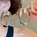 Sculptural Open Oval Earrings in Gold and Silver Tones view 4