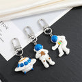 Astronaut and UFO Clip Keychains in Three Space Designs view 1