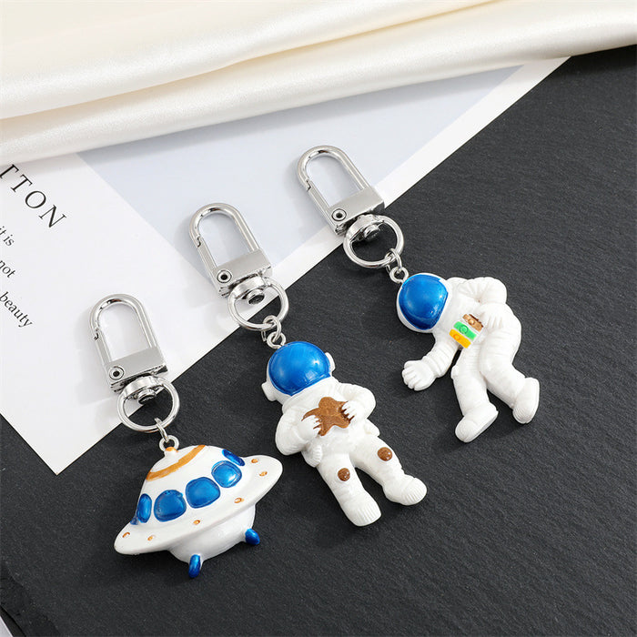 Astronaut and UFO Clip Keychains in Three Space Designs