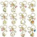 Cat Charm Keychains Featuring White Flower Across 19 Pictured Variations view 5