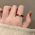 Four Mixed Red Enamel And Crystal Open Ring Designs In Gold Tone view 3
