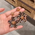 Leopard Flower Resin Drop Earrings in Brown and Black view 3