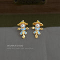 Gold Tone Blue Outfit And White Pearl Scarecrow Stud Earrings view 4