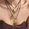Long Black Cord Necklace with Green Floral Frame Pendant view 4
