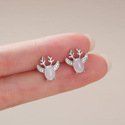 Image 1 showing white oval reindeer stud earrings