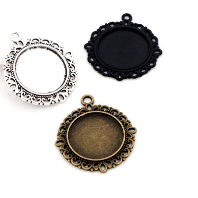 Ornate Round Cabochon Pendant Bases in Bronze and Silver shown in a grouped front view