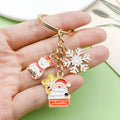Christmas Charm Keychains Featuring Gold Santa Across 41 Pictured Variations view 4