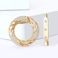 Gold Tone Twisted Circle Brooch With Crystal Accent view 2
