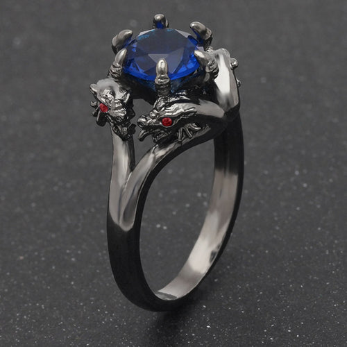 Black dragon claw ring with blue center stone, side angle