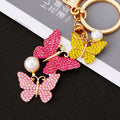 Three Butterfly Drop Keychains in Pink Yellow Purple and White Crystal Palettes view 1