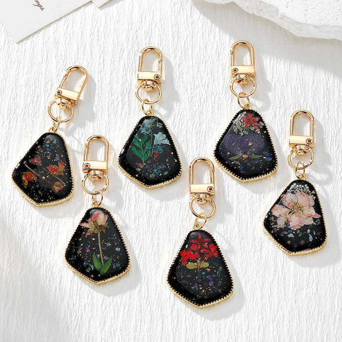 Black Resin Pressed Flower Keychains in Six Designs