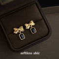 Gold Tone Textured Bow And Black Rectangular Stone Drop Earrings view 3