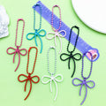 Butterfly Charm Keychains Featuring Magenta Bow Across 17 Pictured Variations view 3