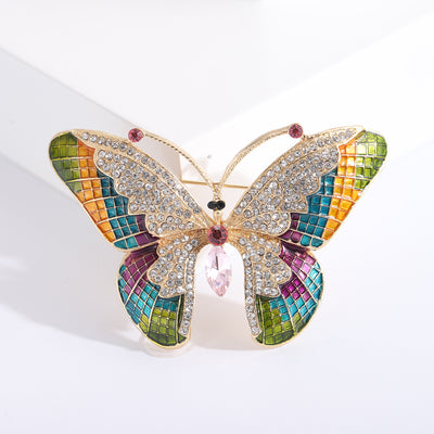 Gold multicolor enamel butterfly brooch with pink crystal abdomen