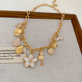 Gold Tone Ocean Charm and Flower Chain Necklaces Statement Jewelry view 6