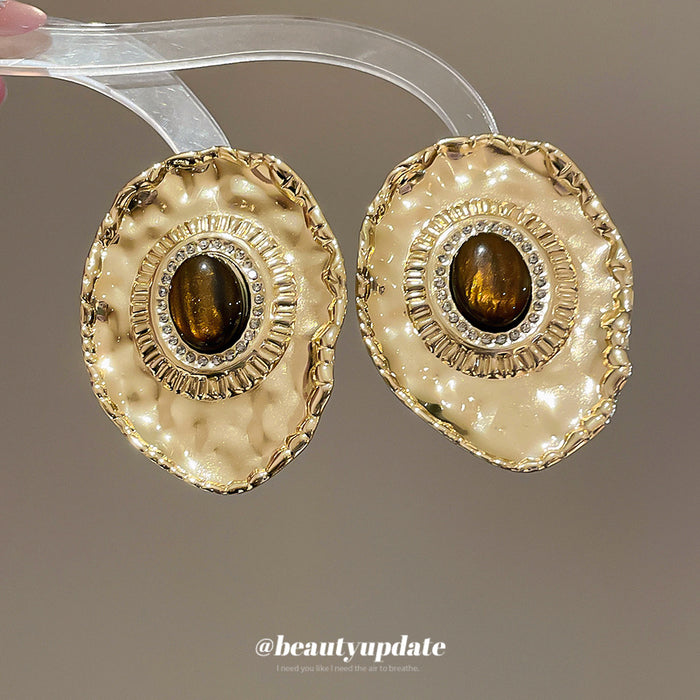 Textured Gold Tone Oval Stud Earrings With Brown Centers