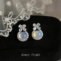 Silver Tone Bow Blue Opal Look Round Stone Halo Stud Earrings view 1