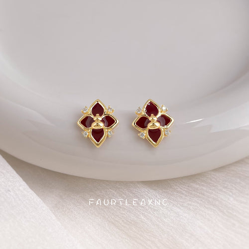 Burgundy enamel flower gourd studs on white plate
