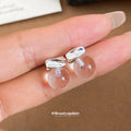 Clear Round Drop Earrings with Sculpted Silver Tone Studs view 1
