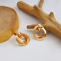 Twelve Gold Tone Sculptural Knot and Hoop Earrings view 7