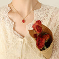 Red Oval Pendant Necklace Gold and Steel Frame Chain view 6