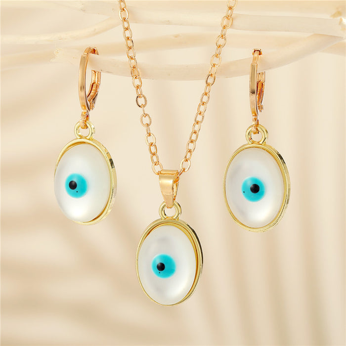 Gold Tone Oval Pearl Blue Evil Eye Pendant Necklace and Earrings