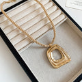 Gold Tone Layered Pearl Chain and Geometric Pendant Necklaces view 6