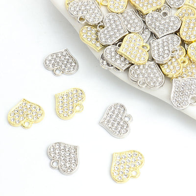 Crystal Heart Alloy Charm Pendants arranged on a white background
