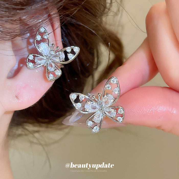 Openwork Crystal Butterfly Silver Tone Clip On Earrings