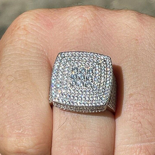 Silver cushion pavé ring worn on knuckle showing full face and sparkle