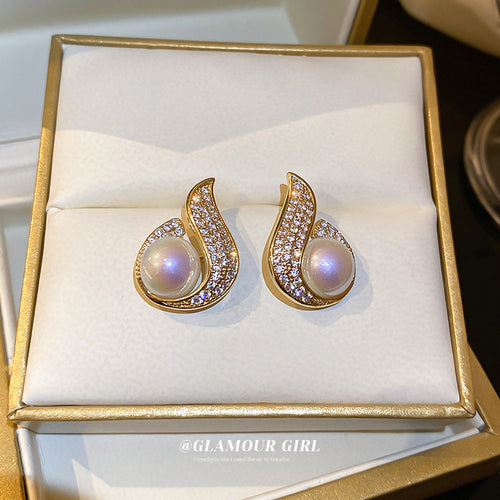Gold Iridescent Pearl Crystal Teardrop Stud modeled at the ear