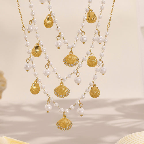 Display view of pearl and shell charm necklaces in main image 2.