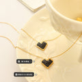 Black Crystal Heart Pendant Necklace Gold Steel Metal Frame view 2