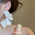 White Iridescent Dimensional Petal Flower Stud Earrings view 3