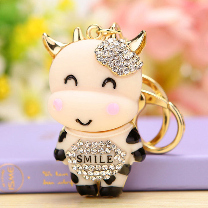 Smiling Cow Keychain with Beige Enamel and Crystal Flower Accent