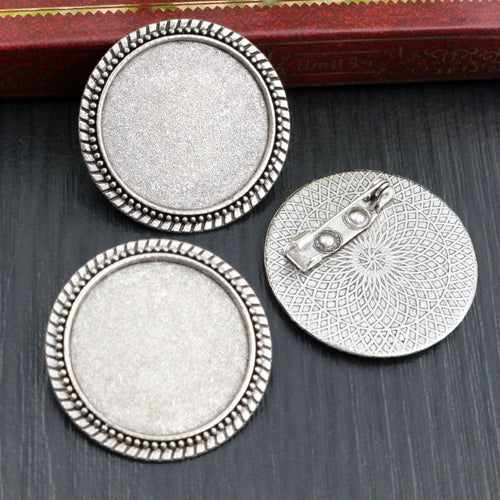 Round Cabochon Brooch Bezel Settings in Two Finishes, close view of the finish and front surface