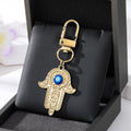 Gold and Silver Tone Crystal Hamsa Hand Evil Eye Clip Keychains in Ten Designs view 6