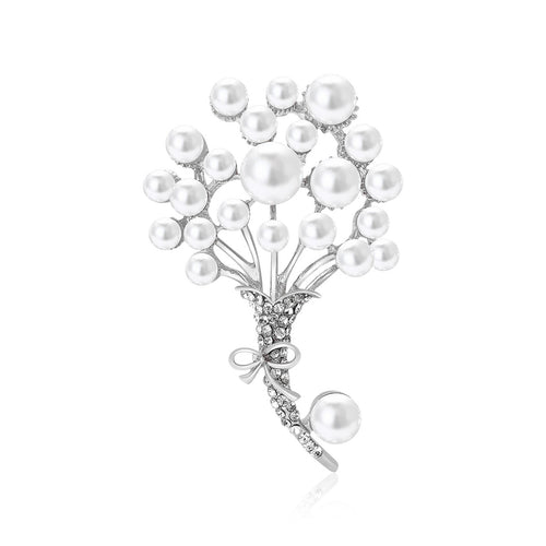 Angled display of branching bouquet of white pearl-like beads with a dangling stem accent