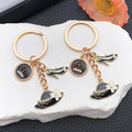 Black and White Crown Hat and Heel Metal Keychain Pair view 1