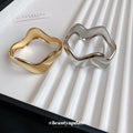 Wide Polished Wave Hinged Bangle In Gold Or Silver Tone view 4
