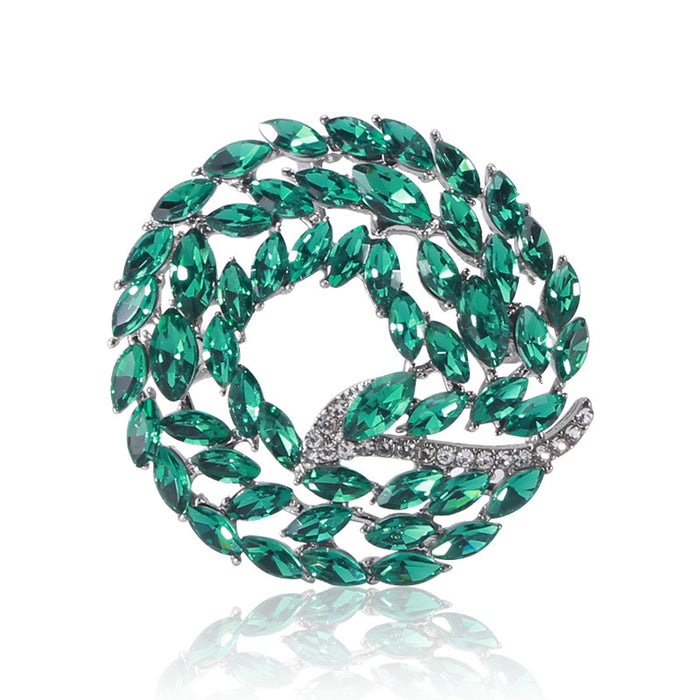 Crystal Braided Circle Brooch with Polished Metal and Decorative Accents