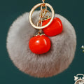 Twin Persimmon Plush Pom Keychains in Fifteen Listed Loop Colors view 11