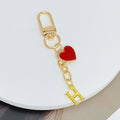 Gold-Tone Letter Charm Keychain with Red Heart Accent view 10