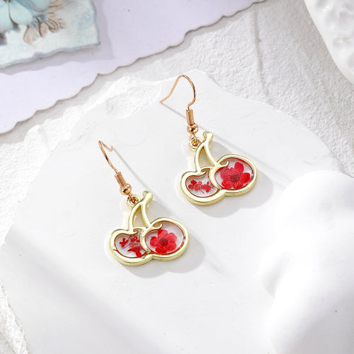 Red dried flower gold cherry shape drop earrings on white stone