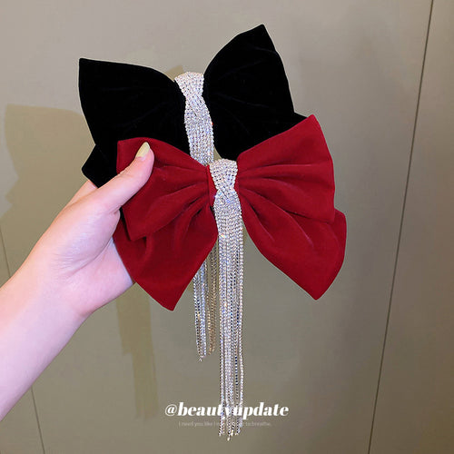 two visibly different velvet bow hair clip designs shown worn in a styled second view