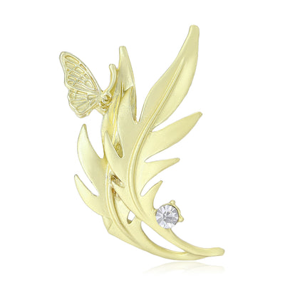 Front view of the leaf and butterfly brooch showing a matte gold-tone leafy sprig with a small butterfly and clear stone
