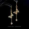Gold Tone Butterfly Long Chain White Pearl Like Hook Earrings view 1