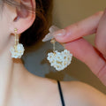 White Floral Pearl Stud and Hoop Earrings in Fourteen Styles view 11