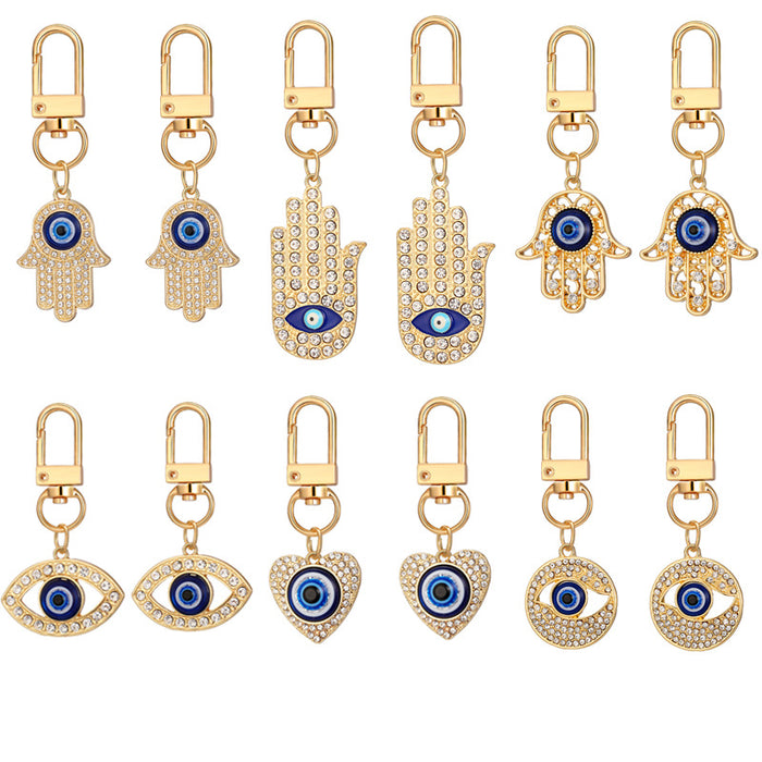 Twelve Piece Gold Tone Crystal Hamsa Heart and Evil Eye Keychain Set