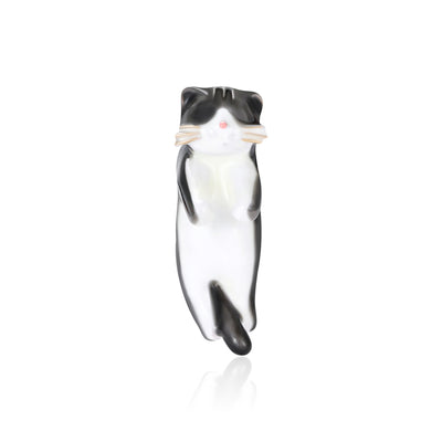 Black White Cat brooch styles arranged on a light display